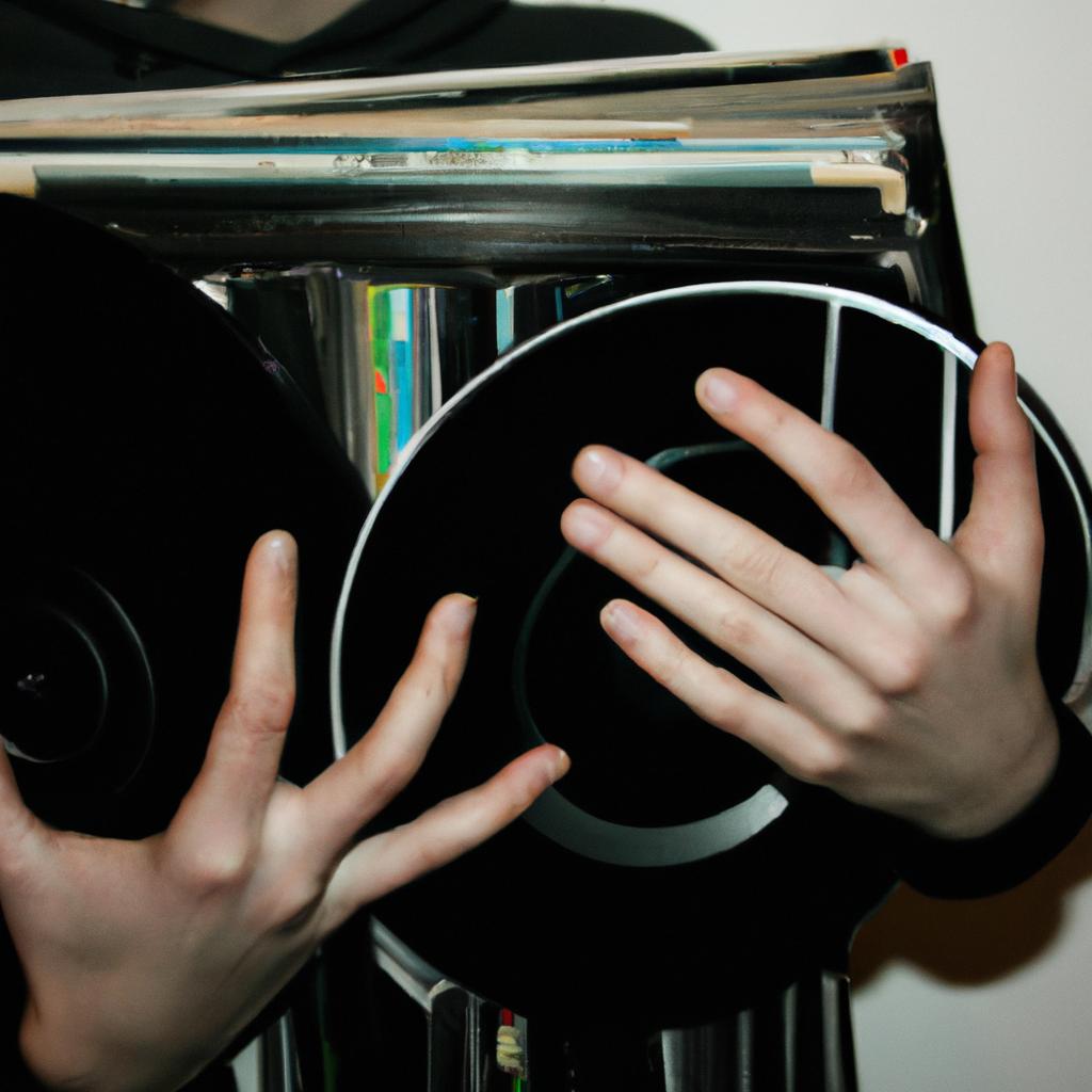 Person holding vinyl record collection