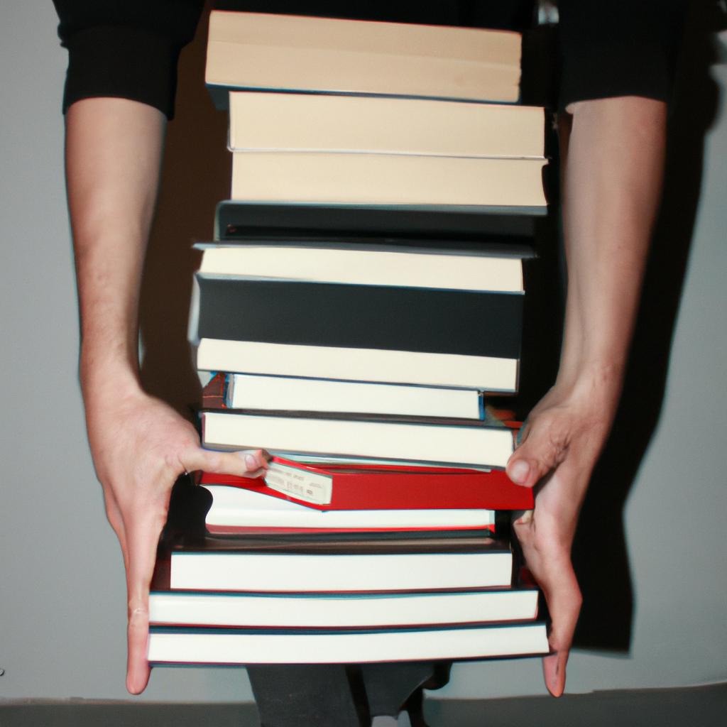 Person holding stack of books