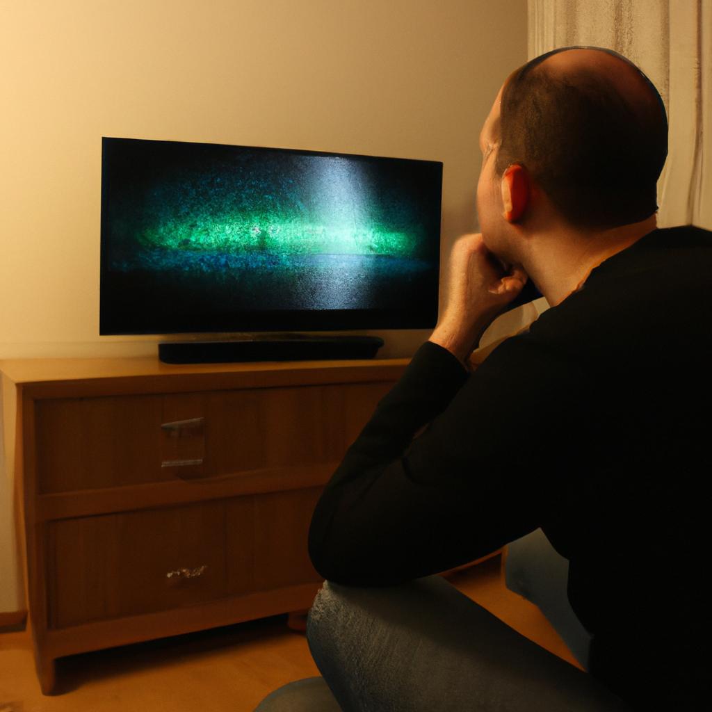 Person watching TV, engrossed